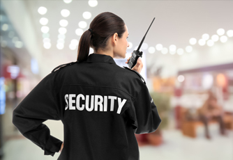 Security guard communicating via a two-way radio