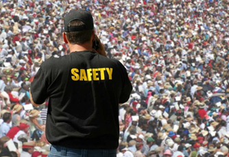 Security guard monitoring a crowd at a public gathering